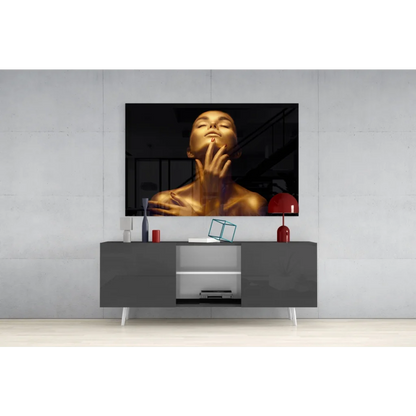 Sleek gray media console with white legs under Golden Glow glass wall art portrait