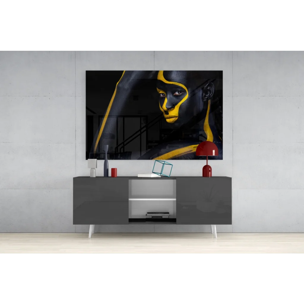 Bold black and gold glass wall art portrait with striking abstract lines