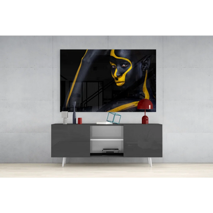 Bold black and gold glass wall art portrait with striking abstract lines