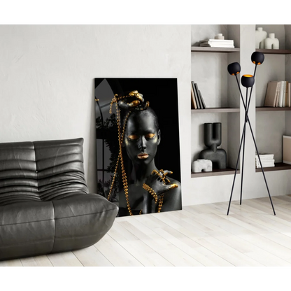 Stunning black and gold glass wall art portrait of woman with metallic makeup