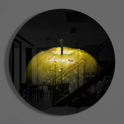 Vibrant yellow apple on Golden Apple tempered glass art with water droplets