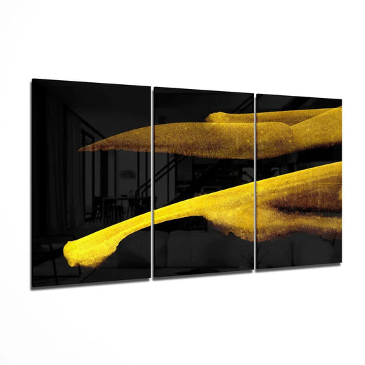 Golden brushstroke glass wall art triptych with yellow textures on black