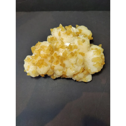 Golden calcite crystal cluster of translucent gummy candies with sugar crystals