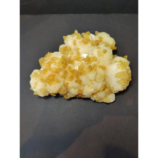 Golden calcite crystal cluster of translucent gummy candies with sugar crystals
