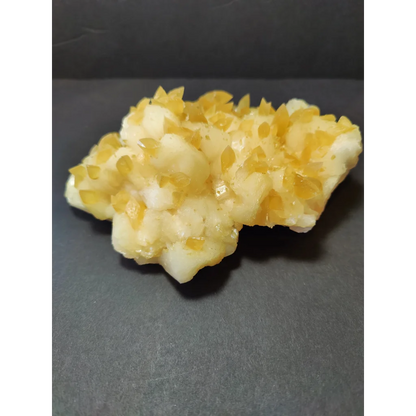 Golden calcite crystal cluster of translucent yellow and white crystals