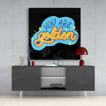 Modern gray TV stand with white legs, red lampshade, and Golden Cloud glass wall art