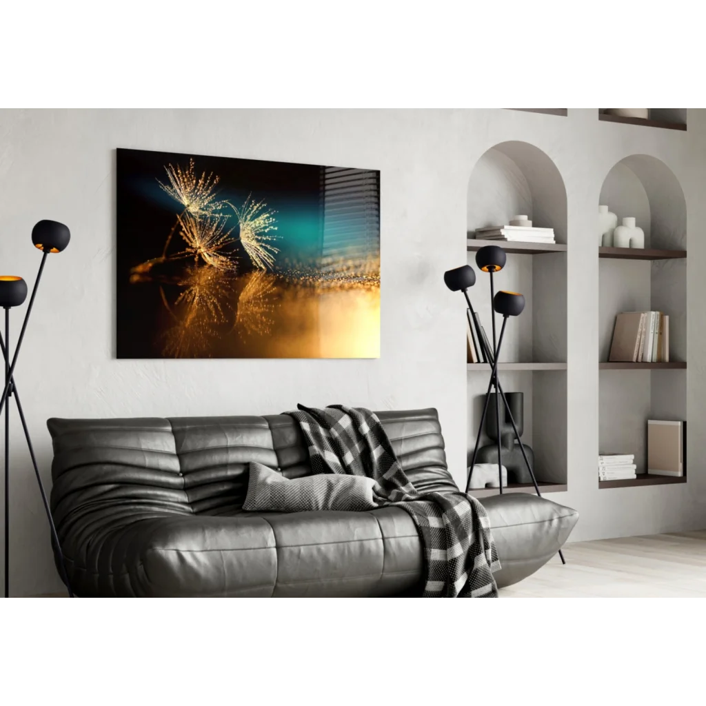 Black leather sofa with quilted texture and gray plaid throw under Golden Dandelion glass wall art