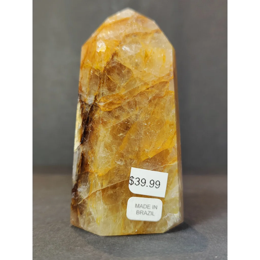Polished golden yellow citrine golden healer quartz obelisk tower sculpture with natural banding made in Brazil priced 39.99