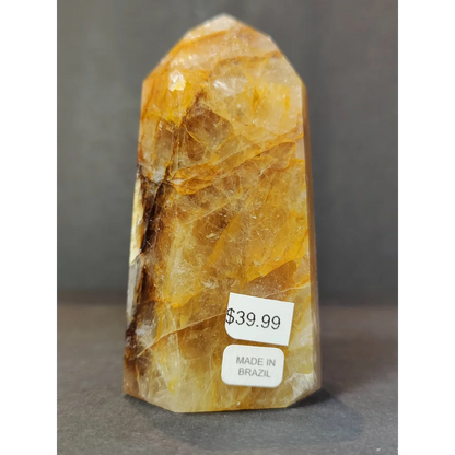 Polished golden yellow citrine golden healer quartz obelisk tower sculpture with natural banding made in Brazil priced 39.99