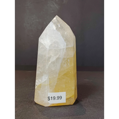 Golden healer polished obelisk tower sculpture featuring a translucent yellow and white fluorite crystal tower