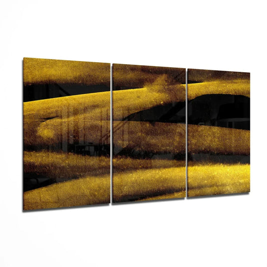 Golden Streak glass wall art triptych with bold horizontal strokes