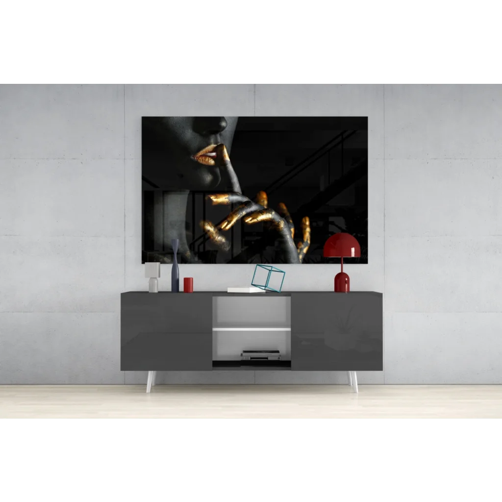 Black and gold abstract portrait wall art with golden hand near lips