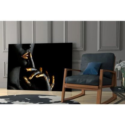 Golden Touch Black canvas wall art: woman’s face with golden lips and hands on dark background