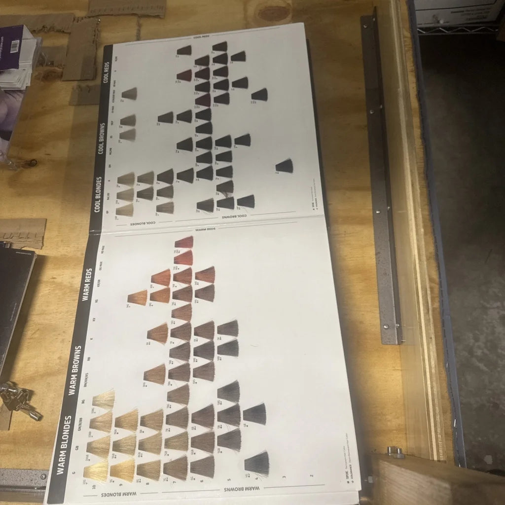 Goldwell color catalog swatch booklet with blonde, brown, red shades