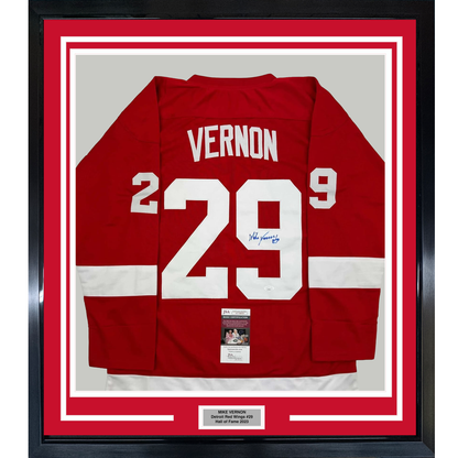 Framed red Detroit Red Wings jersey number 29 with "VERNON" nameplate, signed, displayed front-facing with JSA authentication certificate visible.