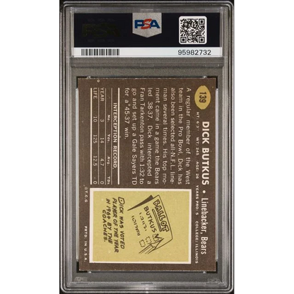 Vintage 1969 Topps Dick Butkus football card graded PSA 7 on display