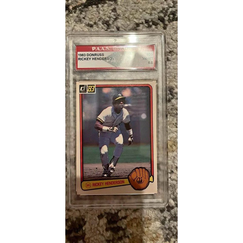 Graded 1983 Donruss Rickey Henderson card in protective slab showcasing Rickey Henderson memorabilia