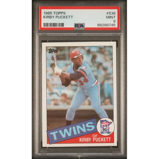 A graded PSA Mint 9 1985 Topps Kirby Puckett Rookie Card #536 in perfect condition
