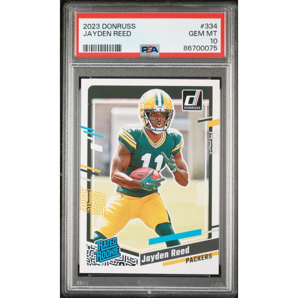 PSA graded 2023 Donruss Jayden Reed football rookie card on display
