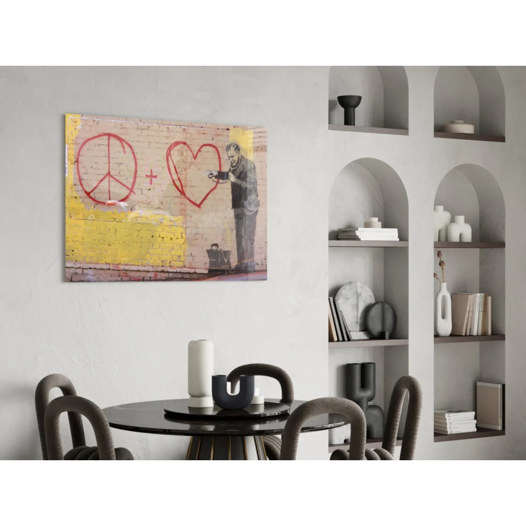 Stunning glass wall art of street scene with red peace symbols on yellow brick wall