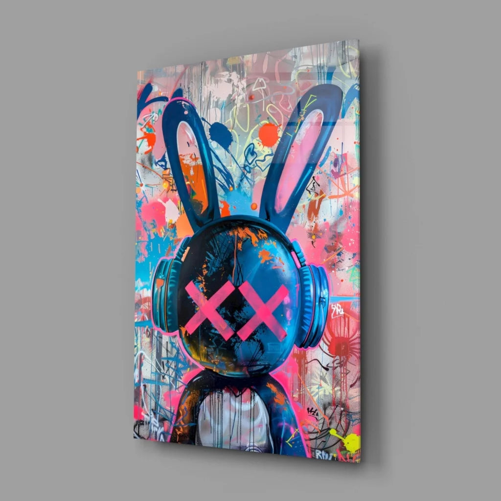 Vibrant blue rabbit with pink X eyes in headphones on Urban Rabbit Beats glass wall art
