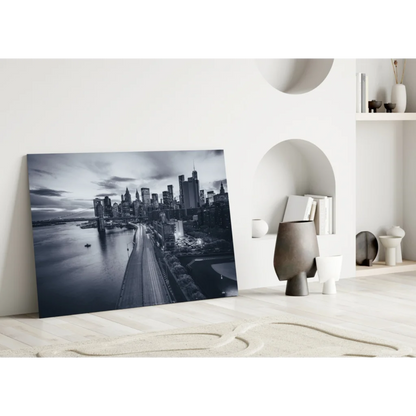 Black-and-white cityscape glass wall art leaning on white wall