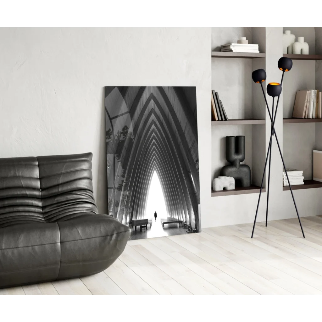 Black leather sofa in modern ribbed design with glass wall art