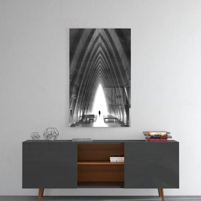 Black-and-white architectural glass wall art with arched beams on gray sideboard