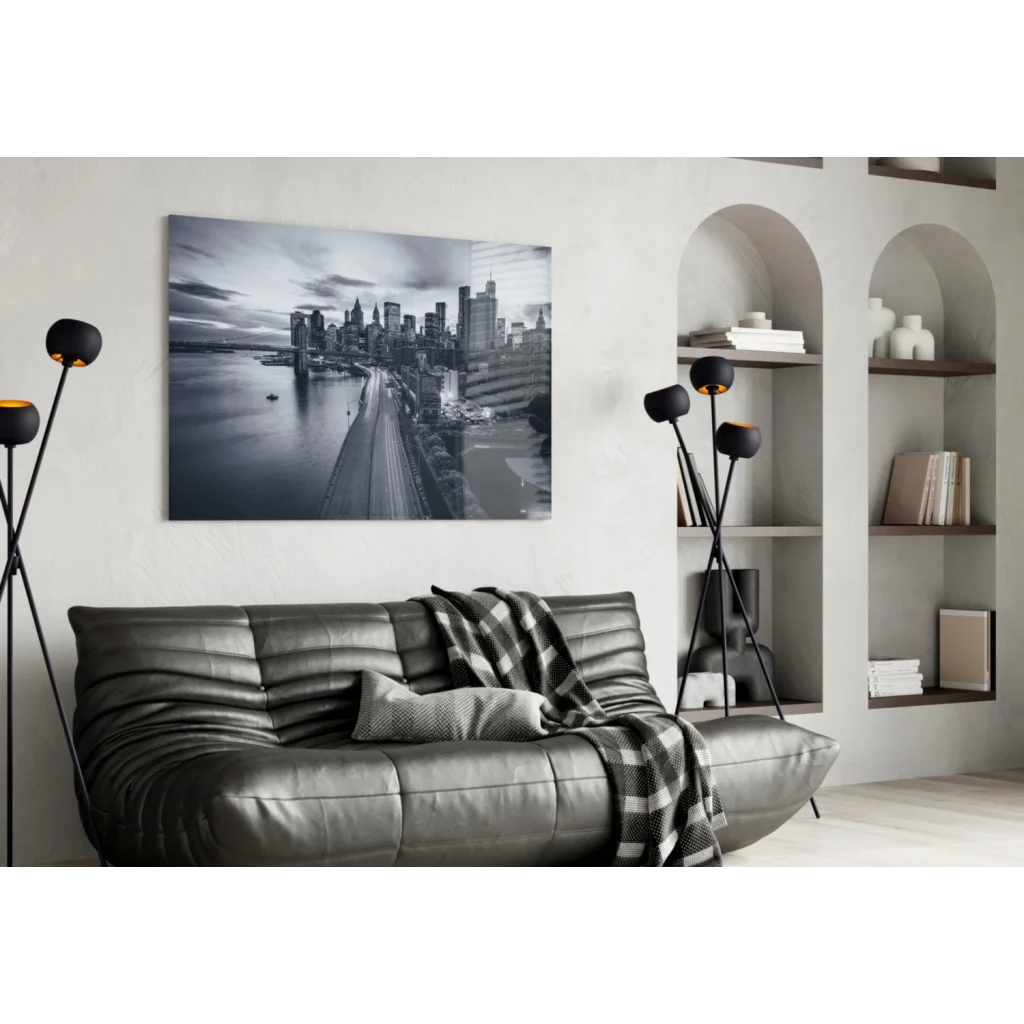 Stunning city skyline glass wall art print with gray leather sofa