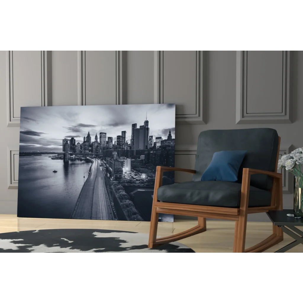 Black and white city skyline glass wall art with lit buildings and bridge