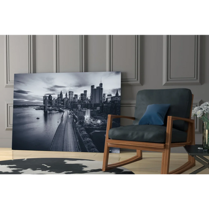 Black and white city skyline glass wall art with lit buildings and bridge