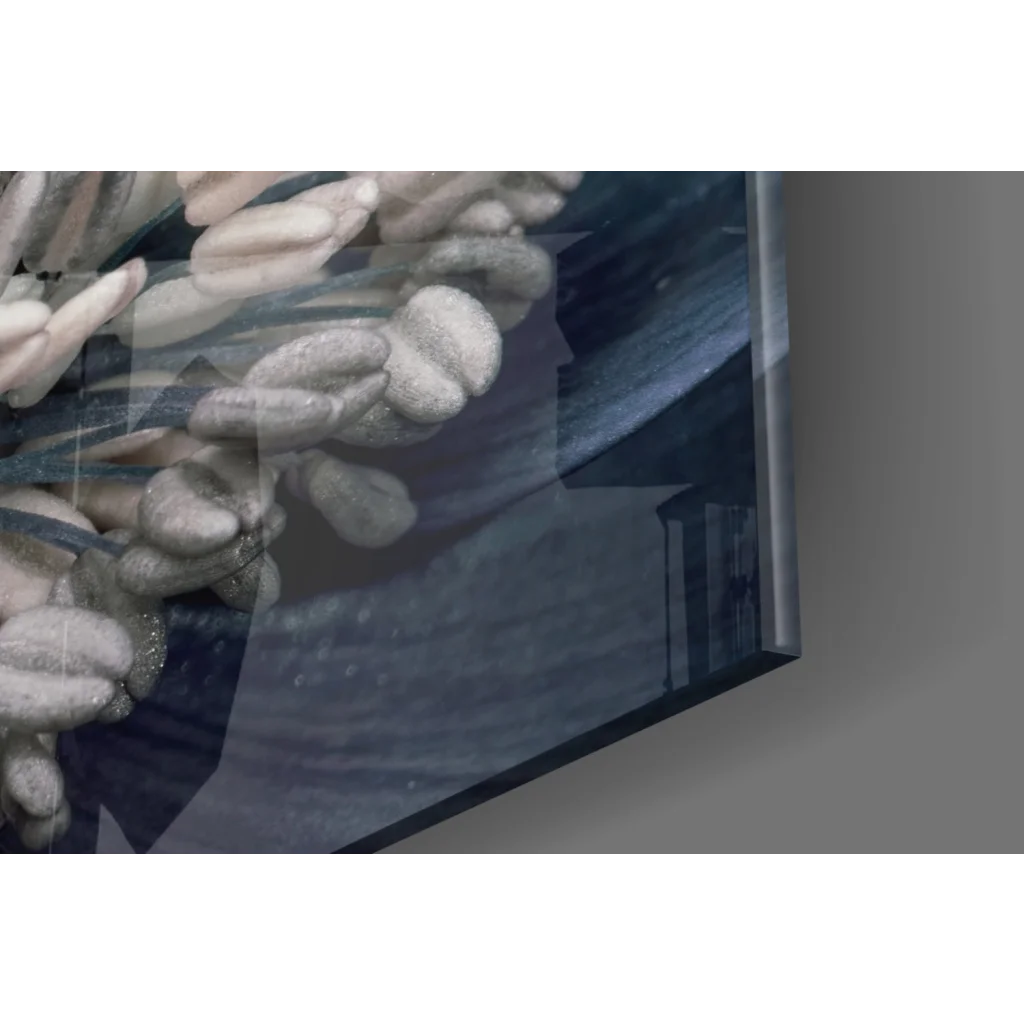 Stunning blue poppy glass wall art with textured gray chain on dark blue background