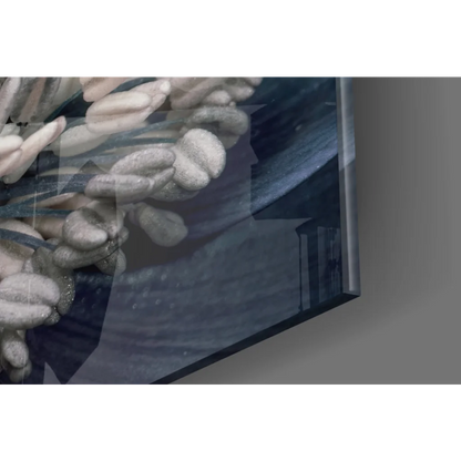 Stunning blue poppy glass wall art with textured gray chain on dark blue background