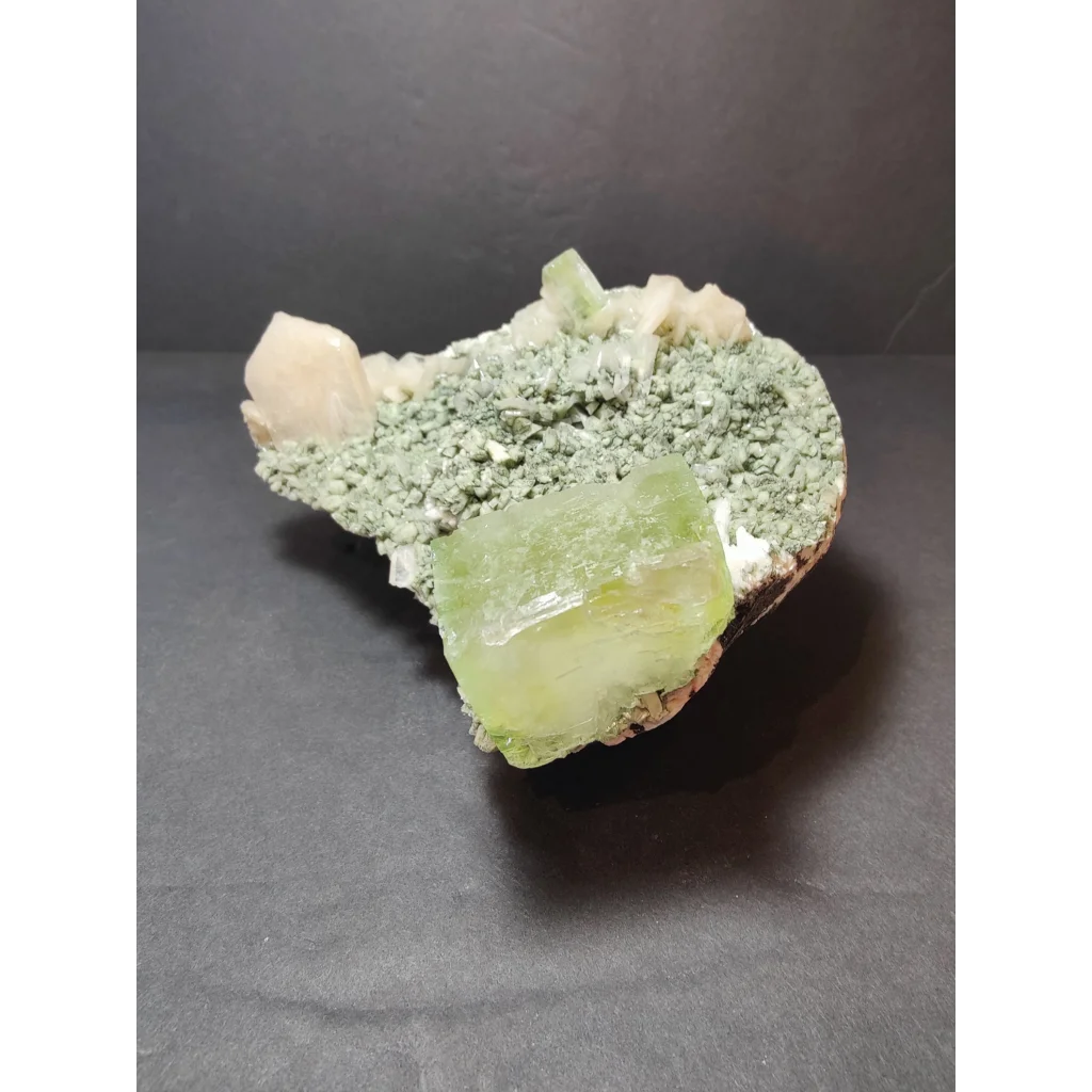 Green apophyllite cubes with translucent fluorite on heulandite specimen