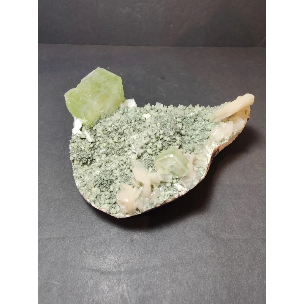 Green apophyllite cubes with peach stilbite on heulandite specimen