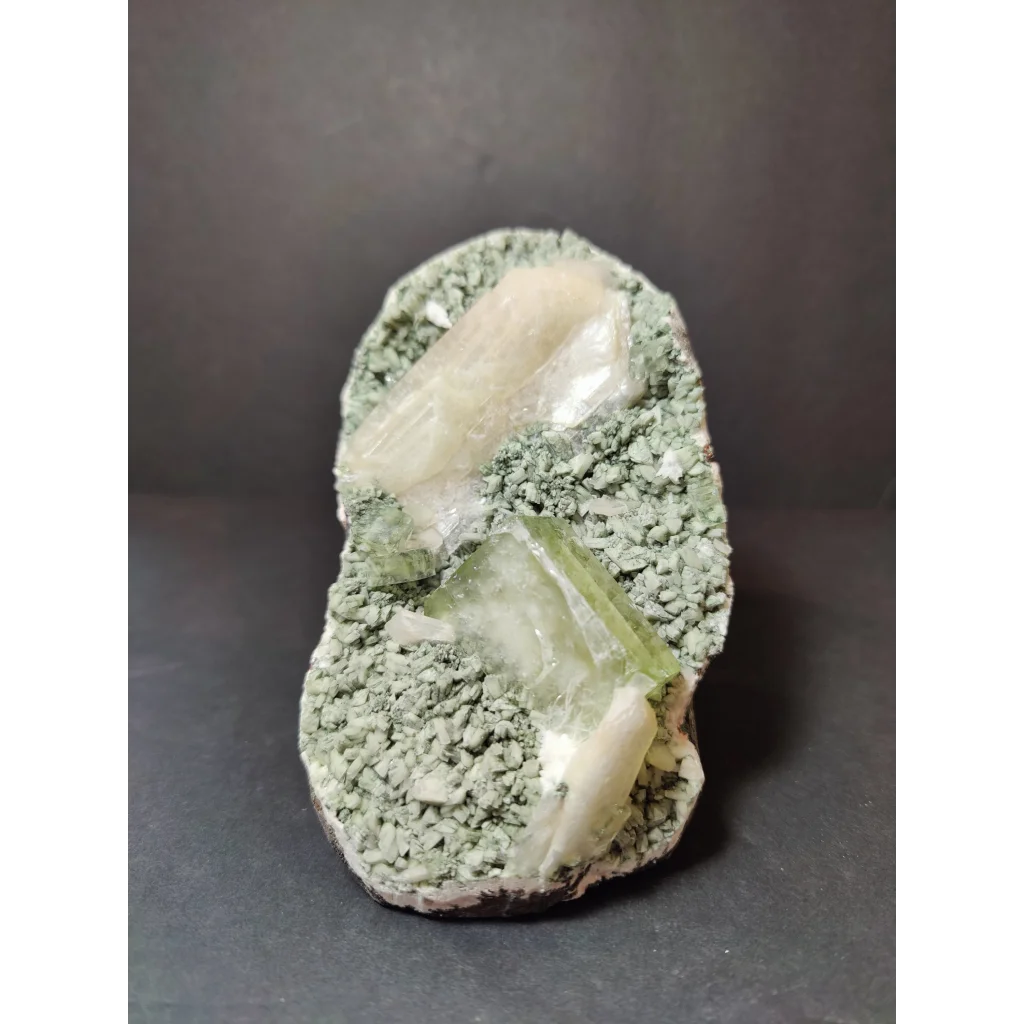 Green apophyllite cubes with peach stilbite on heulandite specimen