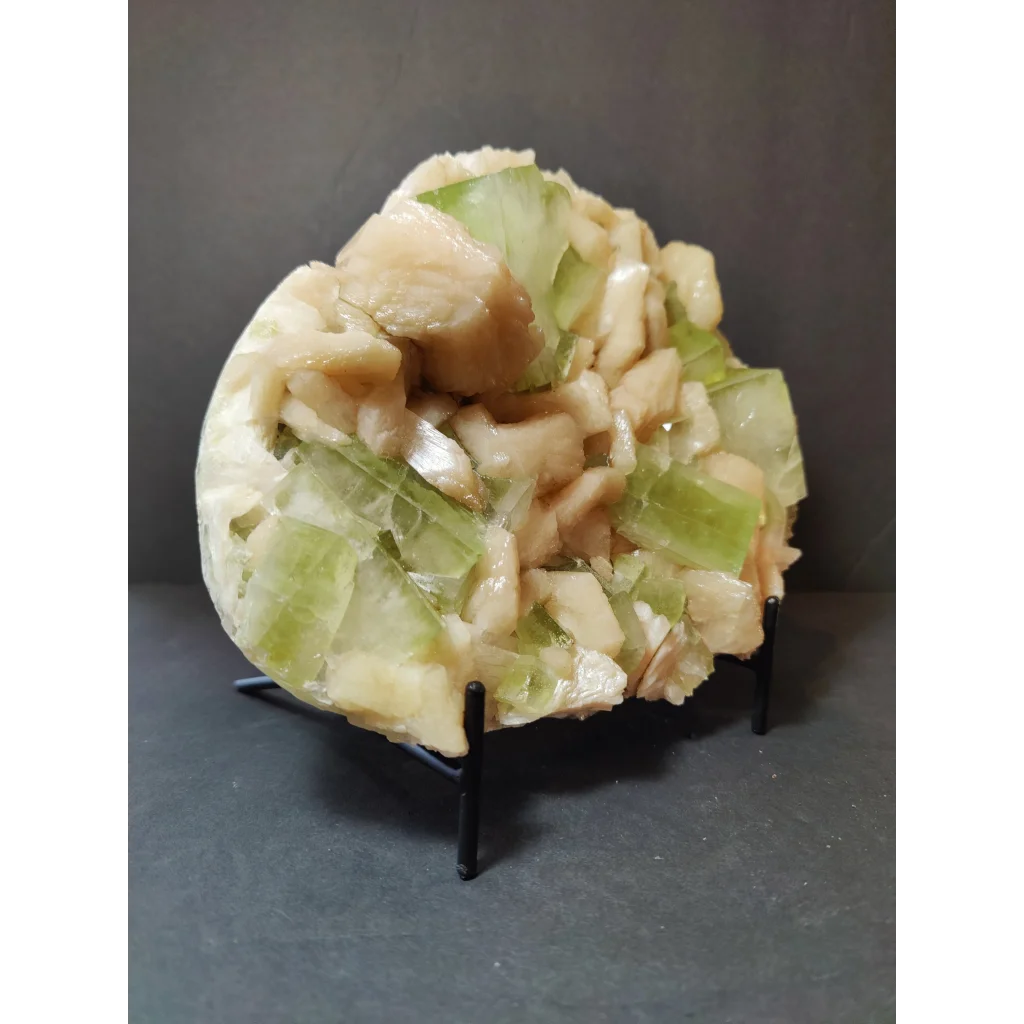 Green apophyllite cubes with peach stilbite specimen on stand