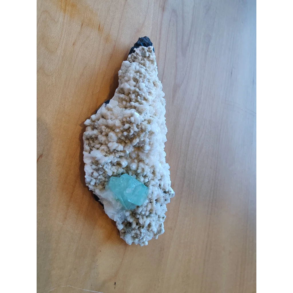 Green apophyllite turquoise crystal in white beige matrix with mordenite