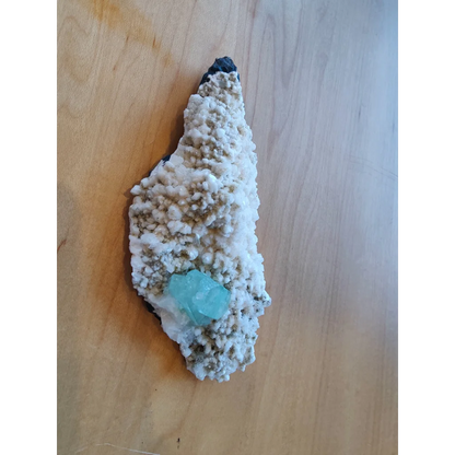 Green apophyllite turquoise crystal in white beige matrix with mordenite