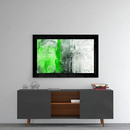 Bold green streak glass wall art in black frame with vibrant abstract design