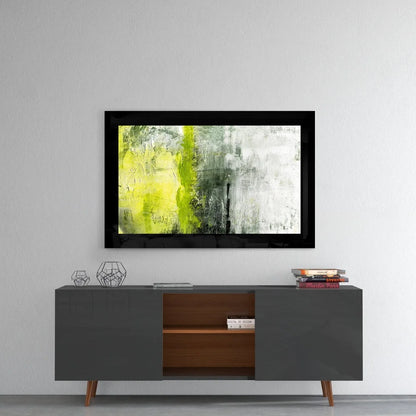 Bold abstract wall art in black frame with yellow and green strokes