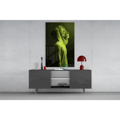 Lime-green lion profile glass wall art on gray console table