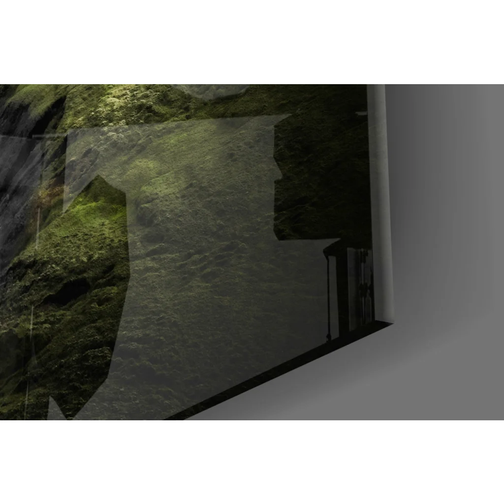 Sleek black-framed glass wall art of blurred mossy rock wall