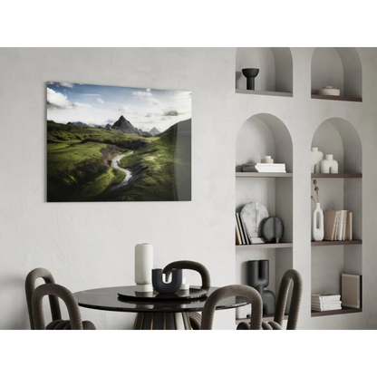Vibrant green mountain glass wall art with winding river under cloudy sky