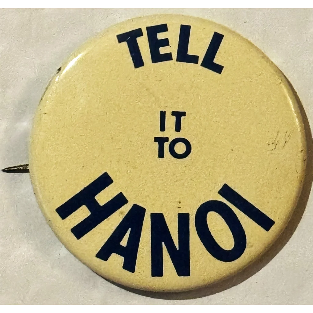 Cream-colored button pin with black text for Groovy 60s Vietnam War Peace Pins