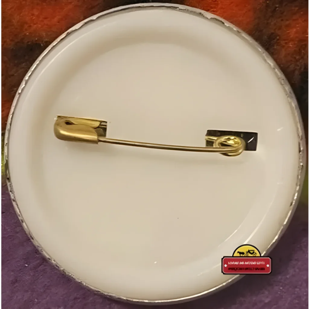 Safety pin on a white surface, perfect for attaching your California Raisin Tin