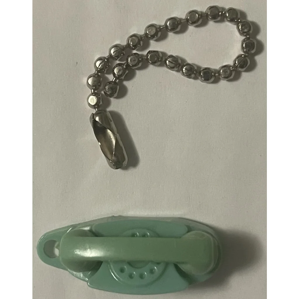 Pale green plastic toy rotary phone for 1960s green princess keychain