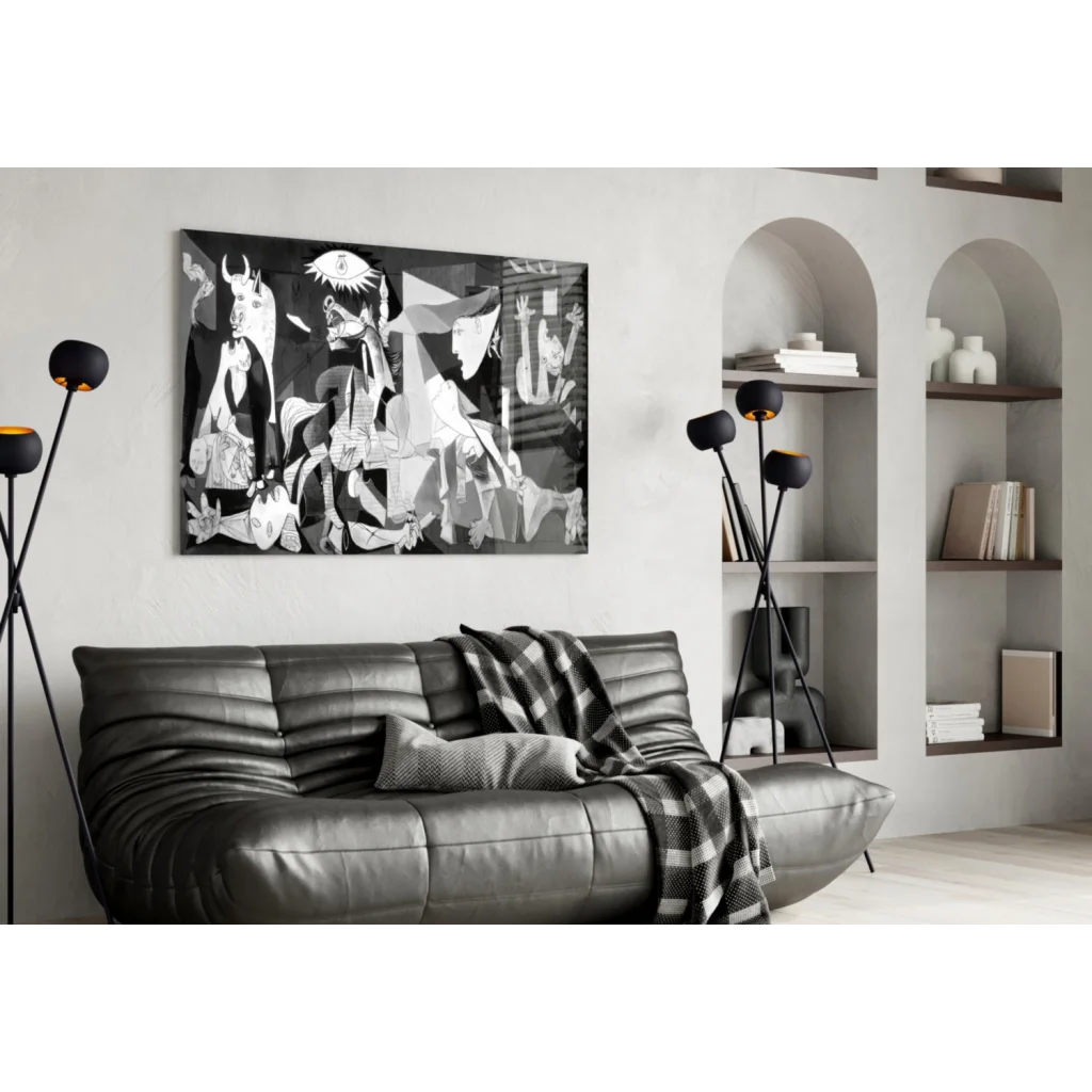 Picasso style cubist eye black and white abstract wall art above gray sofa