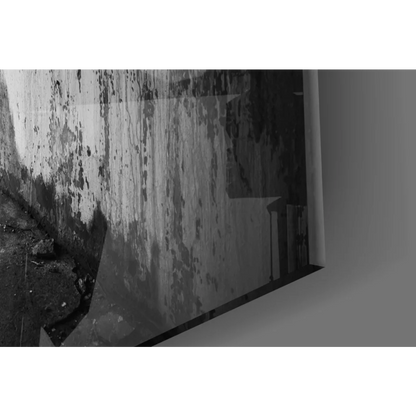 Black and white urban concrete wall art print of weathered peeling wall with mold