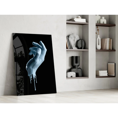 Striking blue dripping hand glass wall art canvas print on glossy finish